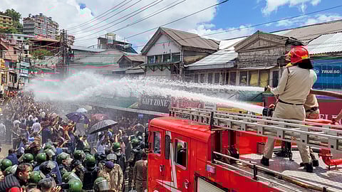Police use water cannons to disperse protesters |